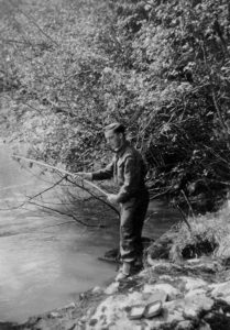 Henri fishing while stationed near Terrace, BC. (Summer 1943)