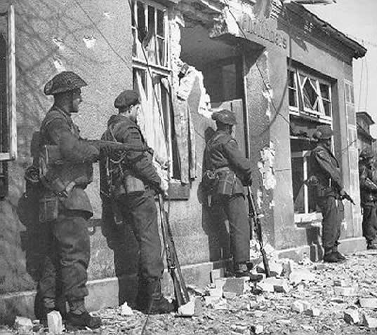 The Lincoln and Welland Regiment clears snipers from the town of Werlte, Germany on April 10th 1945.