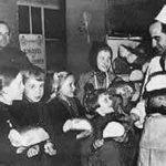 Dutch children attending a Canadian Army sponsored Christmas Party were sent home with loaves of bright white bread.