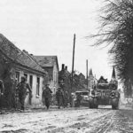 The Lincoln and Welland Regiment passes through Sonsbeck Germany on March 7th 1945.